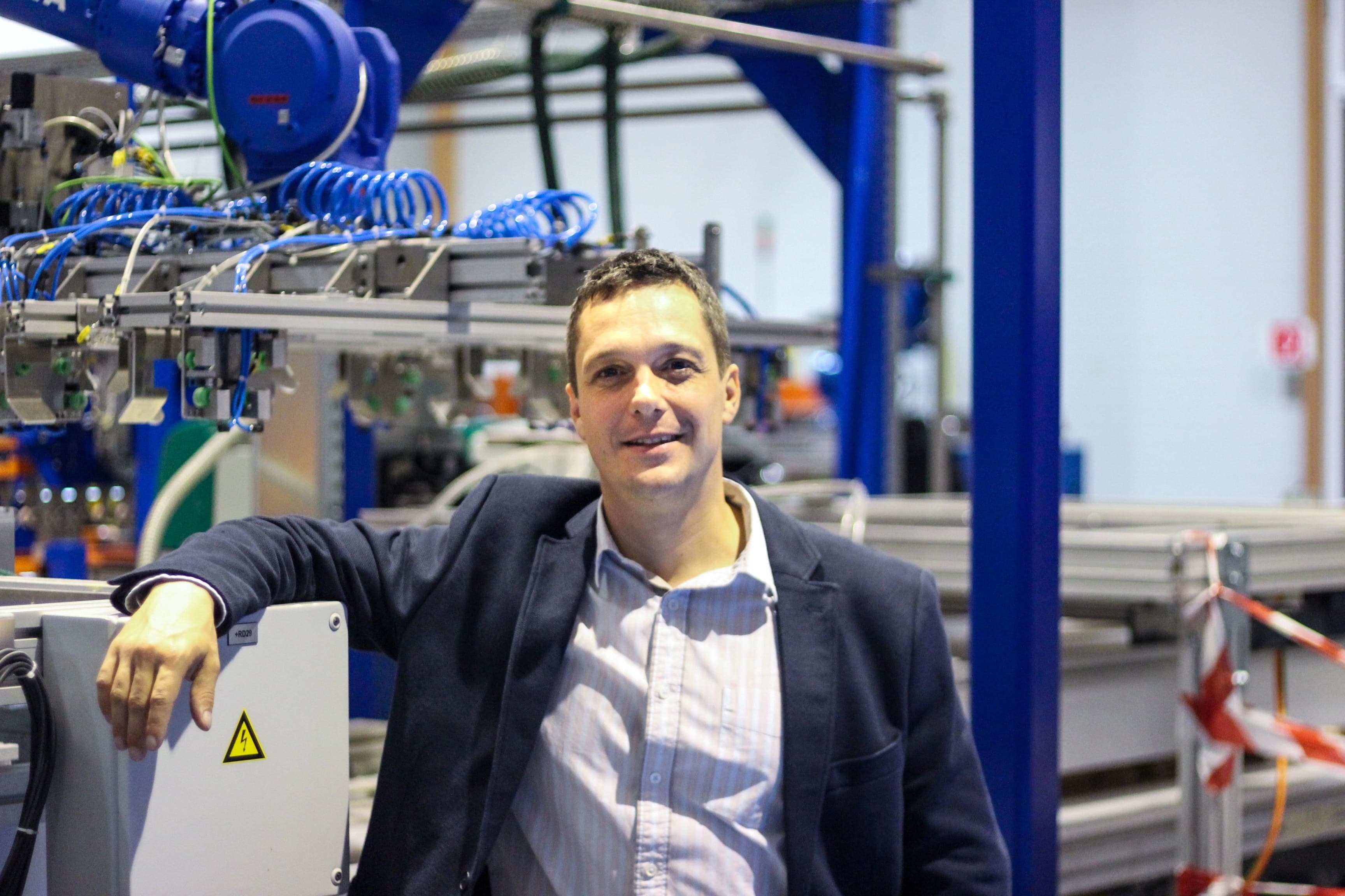 Gregor Brajović alongside industrial innovation machinery