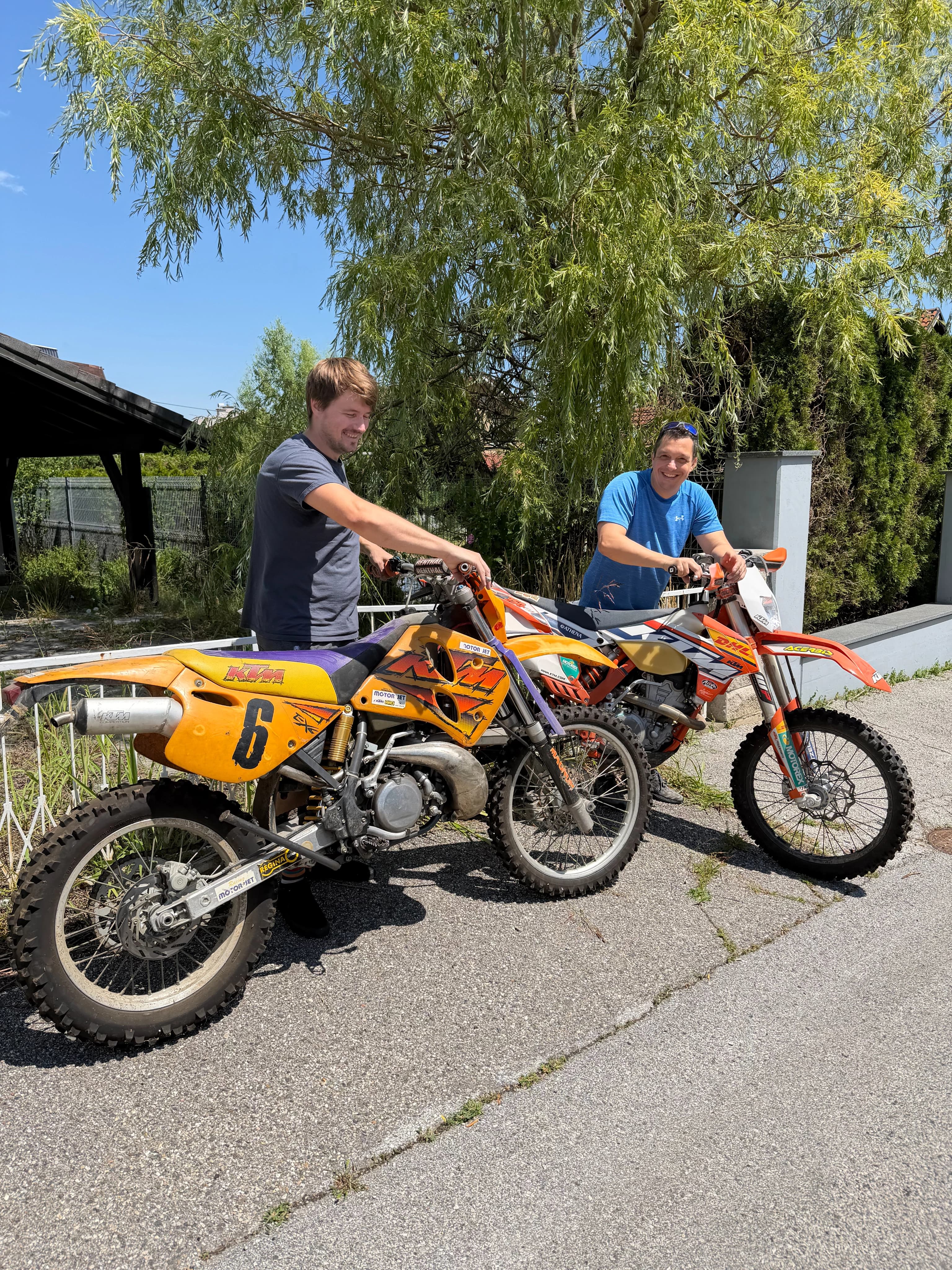Gregor Brajović sharing a moment with a colleague outdoors
