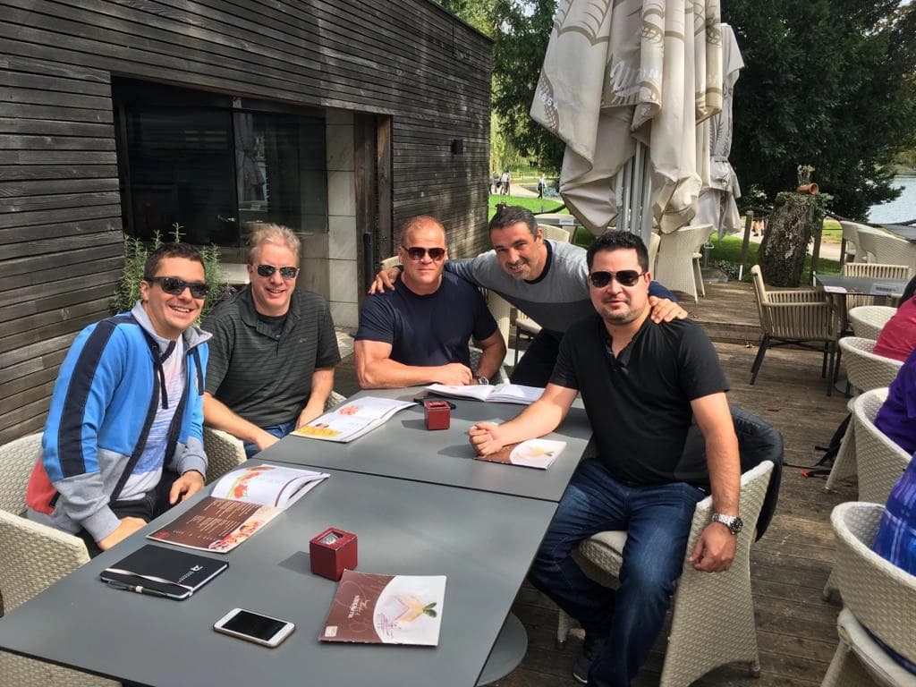 A group of colleagues meeting by the water