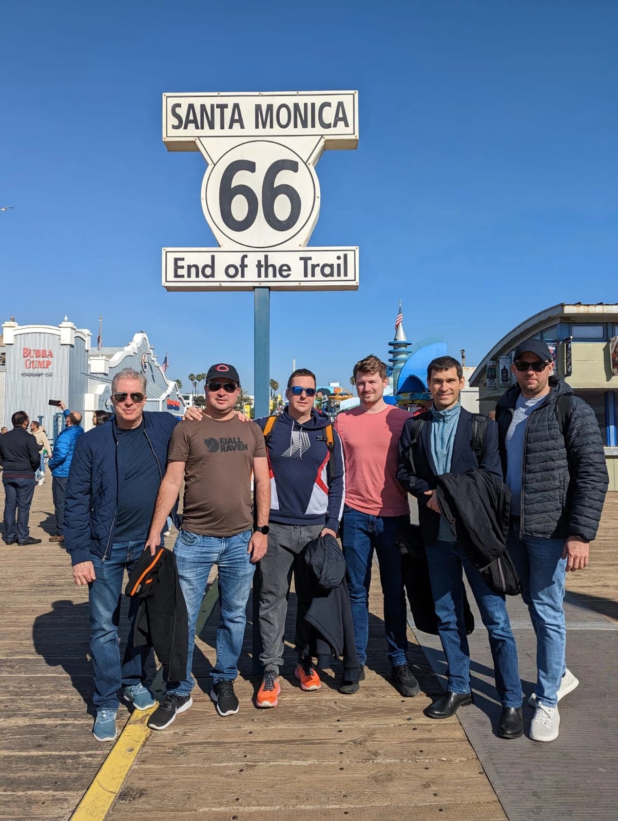 A group of collaborators at the end of Route 66 in Santa Monica