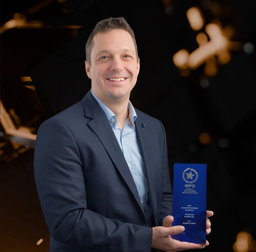Gregor Brajović holding an international packaging award