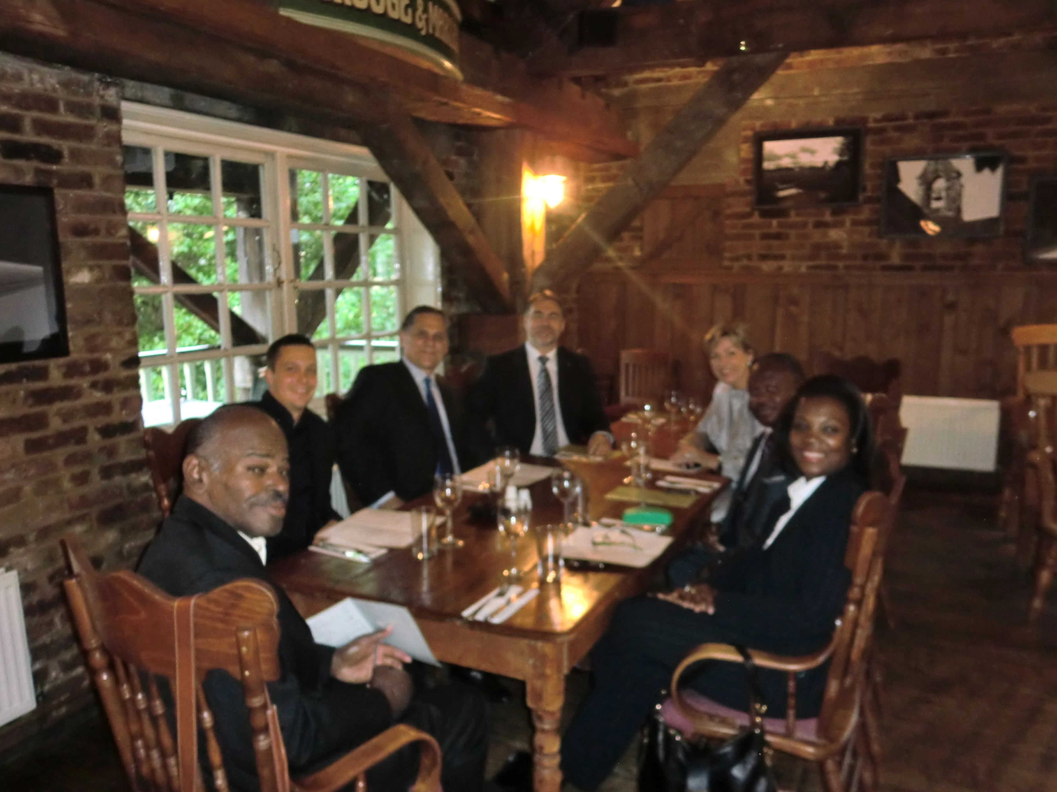 A group of international partners meeting around a table
