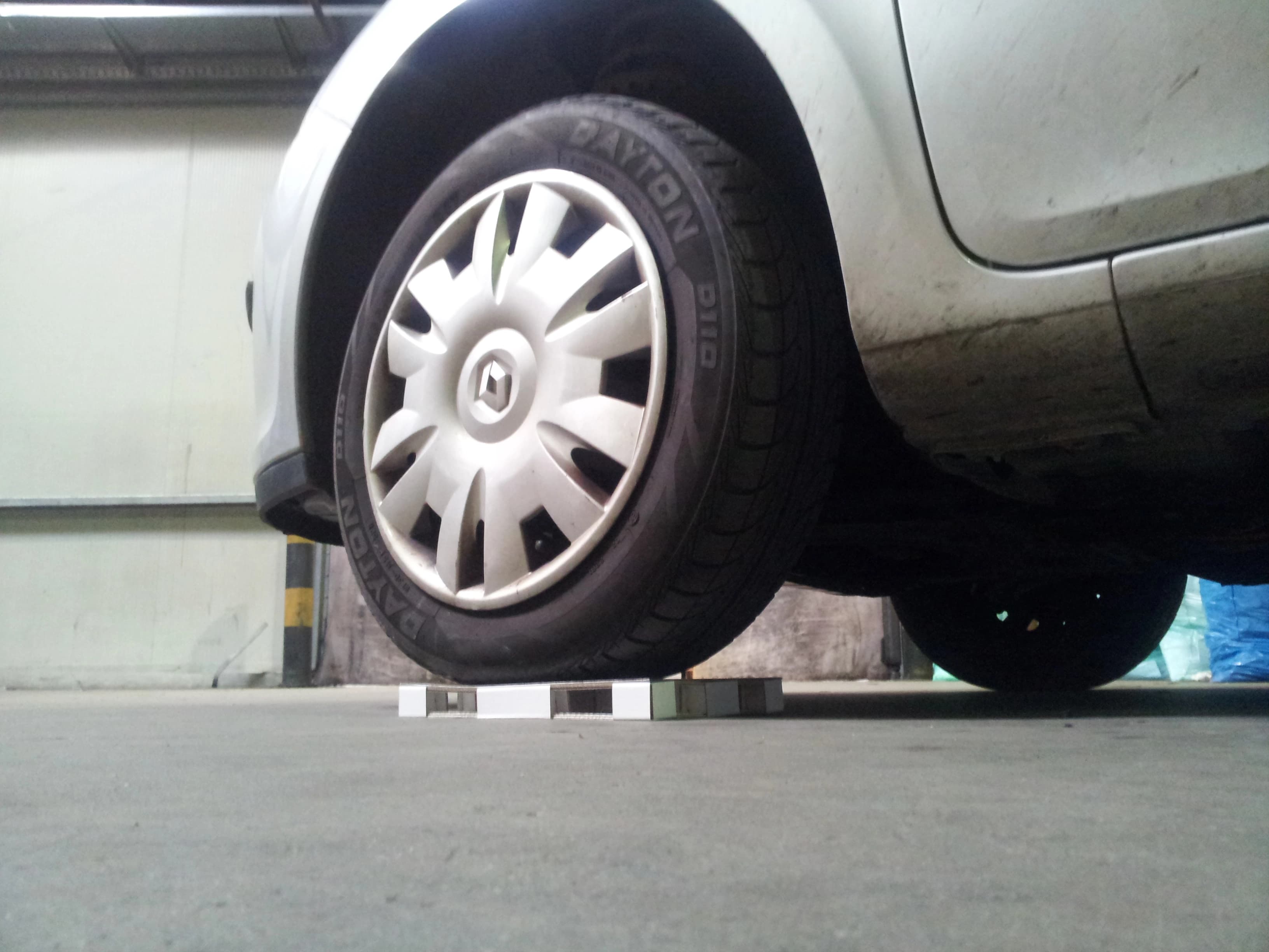 A vehicle testing a KraftPal pallet in an industrial setting
