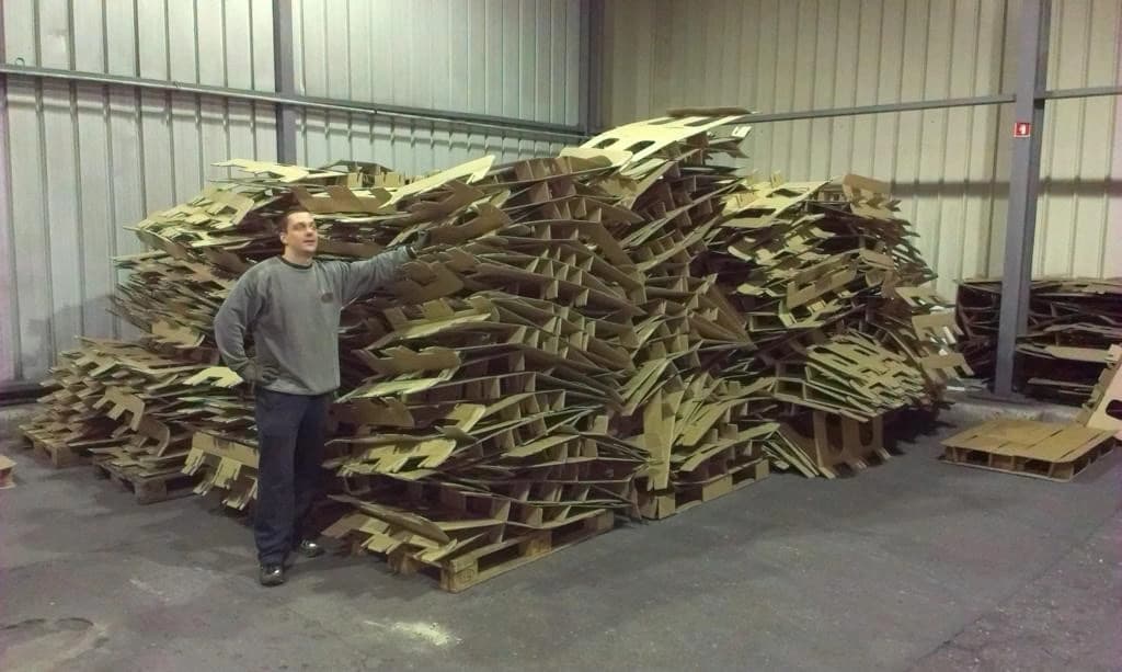 Gregor Brajović beside early KraftPal corrugated pallet materials