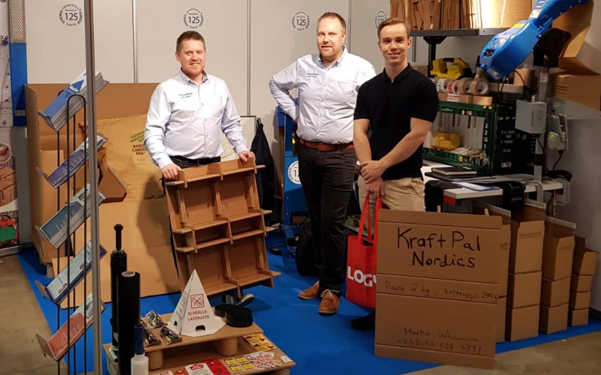 KraftPal team beside production machinery