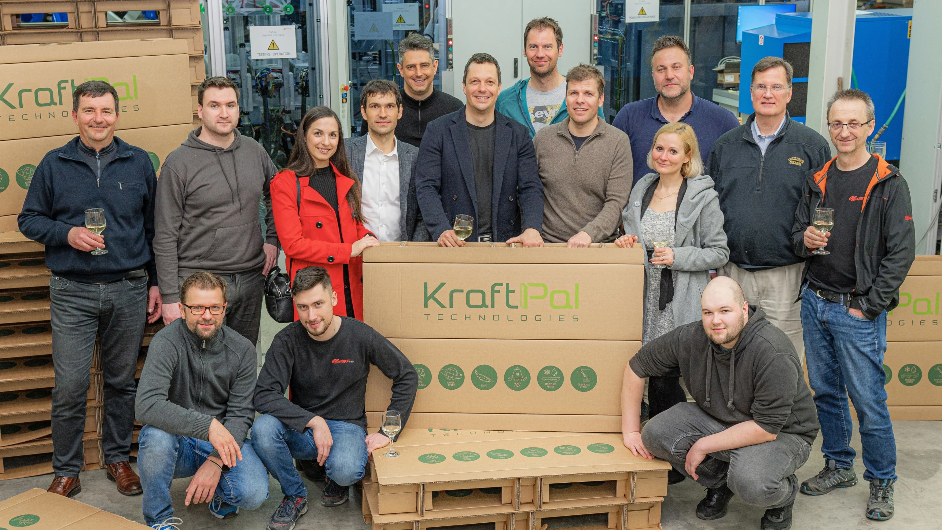 KraftPal team gathered around a finished fibre pallet