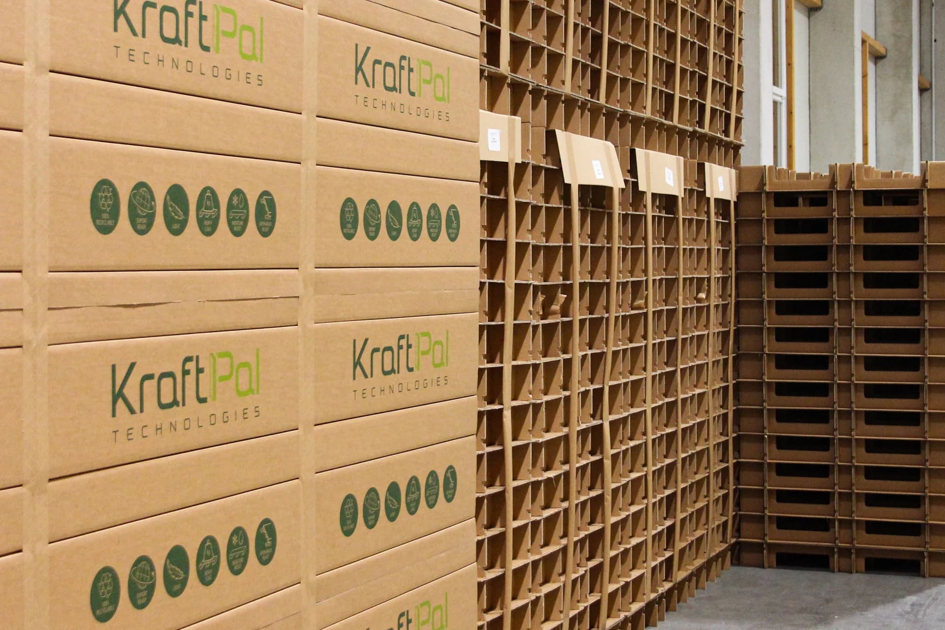 Stacks of KraftPal corrugated pallets in storage