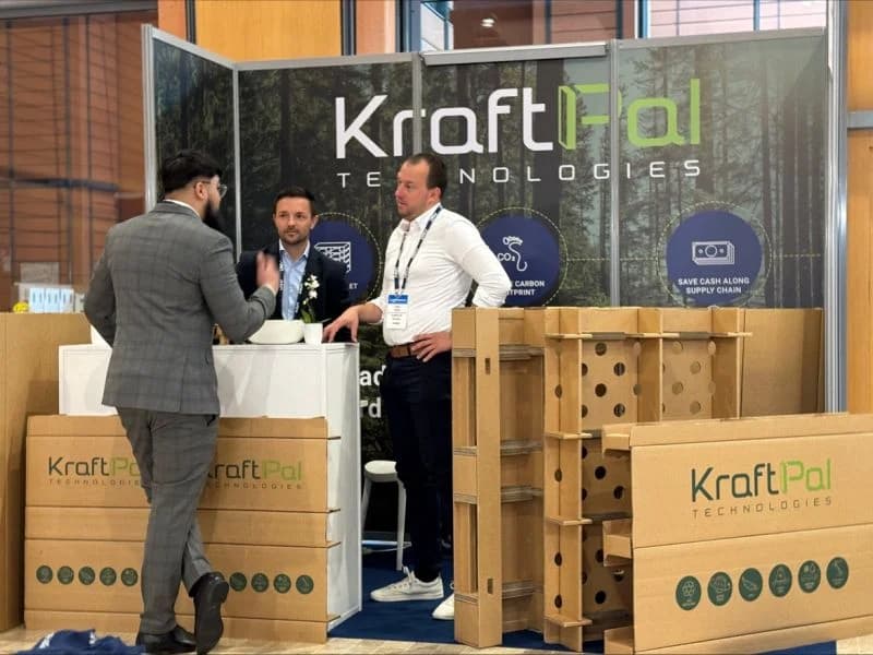 KraftPal team meeting visitors at an industry exhibition