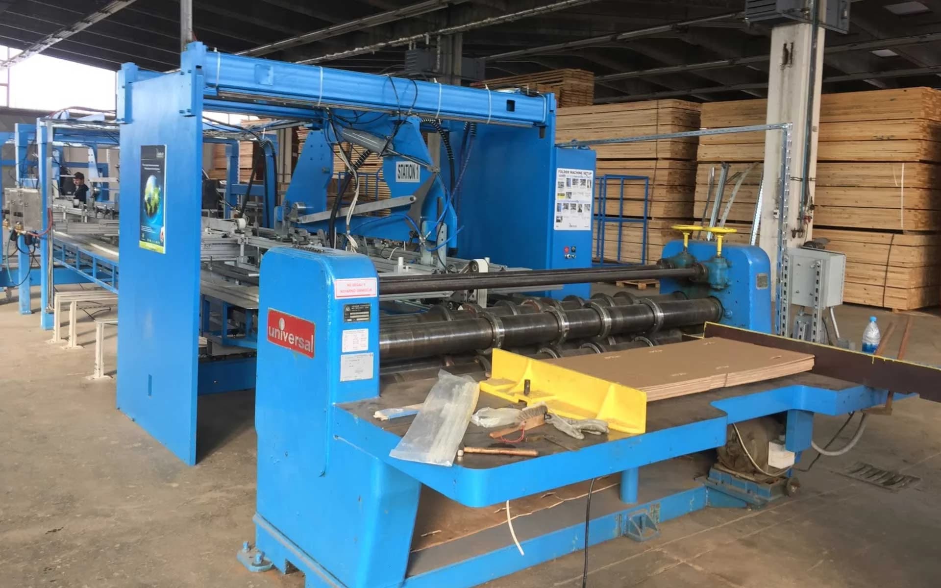 Early KraftPal manufacturing machinery in a production facility