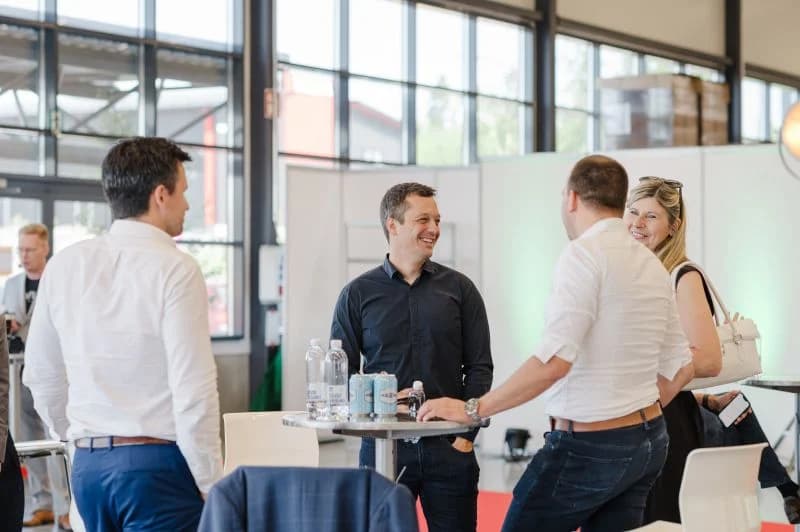 Gregor Brajovic speaking with collaborators during an early technology project
